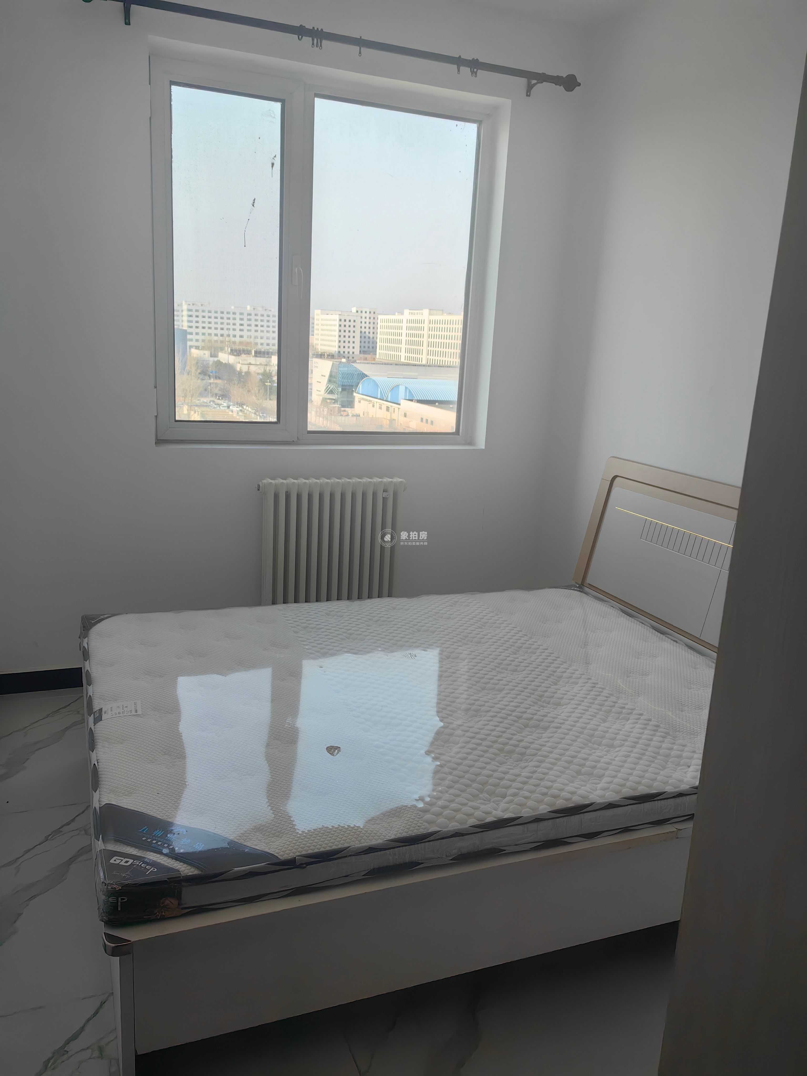 唐家岭北环路2号院12号楼10层四单元1001号房屋（实际为：12号楼四单元地上第9层01房屋）